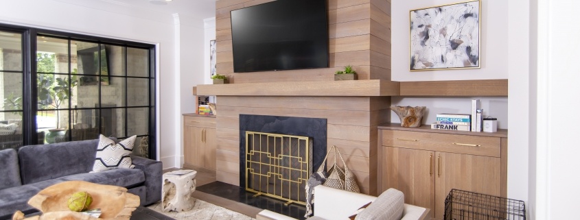 white oak fireplace mantle and accent wall in living room